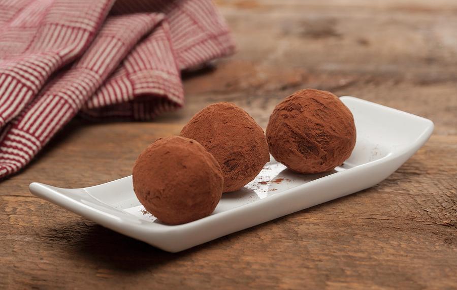 Three Chocolate Truffles With Cocoa Powder Photograph by Albert P Macdonald
