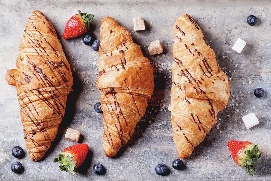 Three Croissants With Blueberries, Strawberries And Sugar Cubes Photograph by Natasha Breen