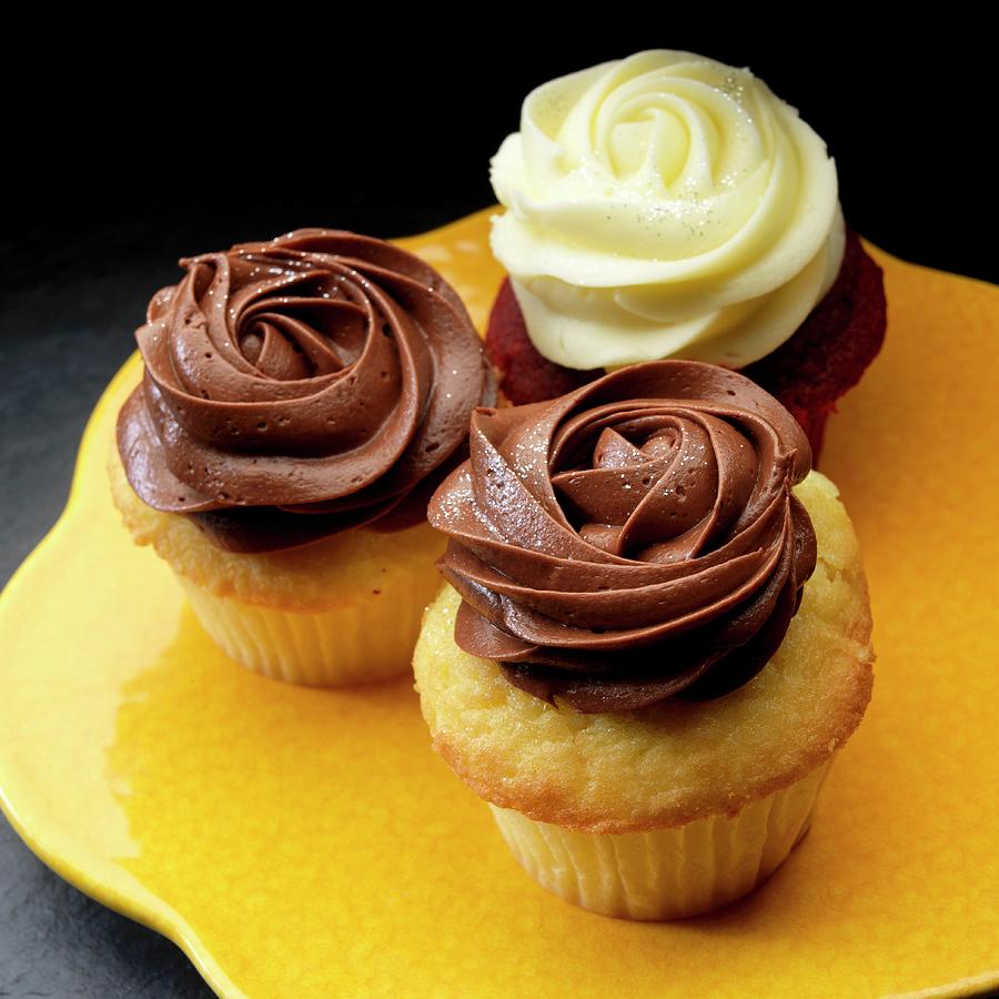 Three Cup Cakes With Dark And White Chocolate Cream Icing Photograph by Paul Poplis
