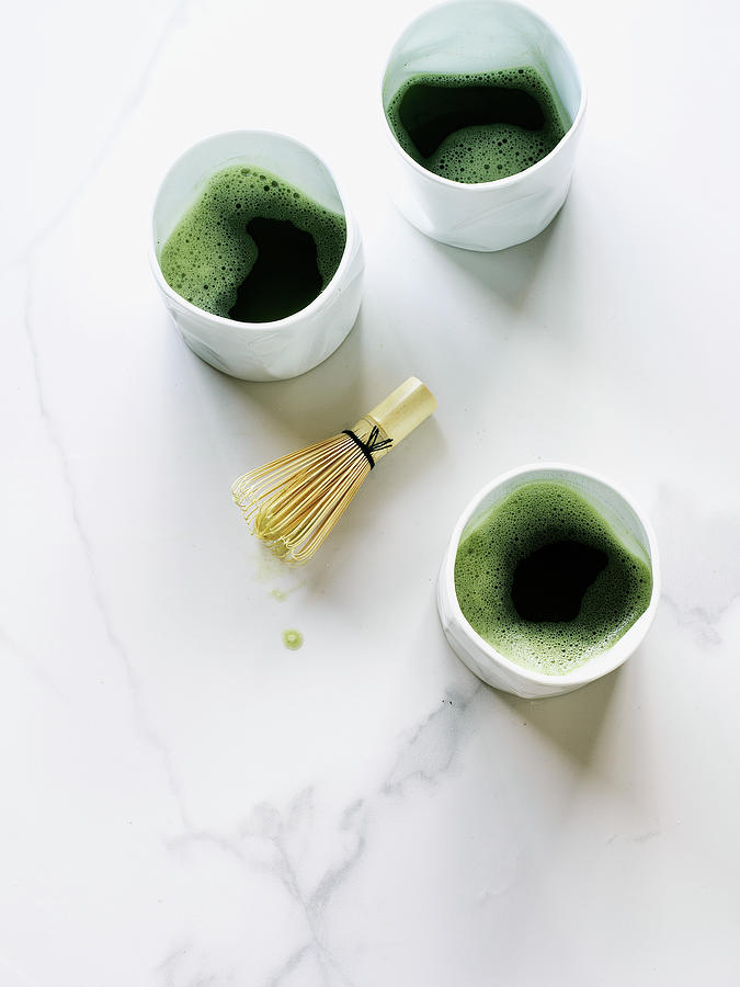 Three Cups Of Matcha Tea With Whisk Photograph by Valerie Janssen