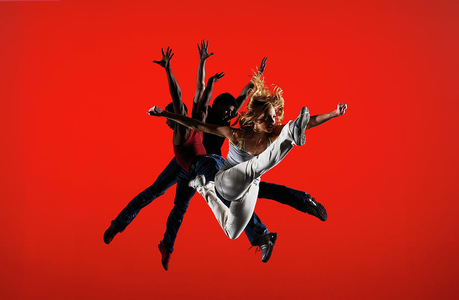 Three Dancers Leaping On Stage Photograph by Thomas Barwick