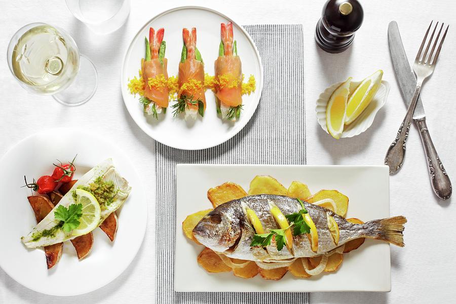 Three Different Fish Dishes With Lemons And White Wine Photograph by Malgorzata Stepien