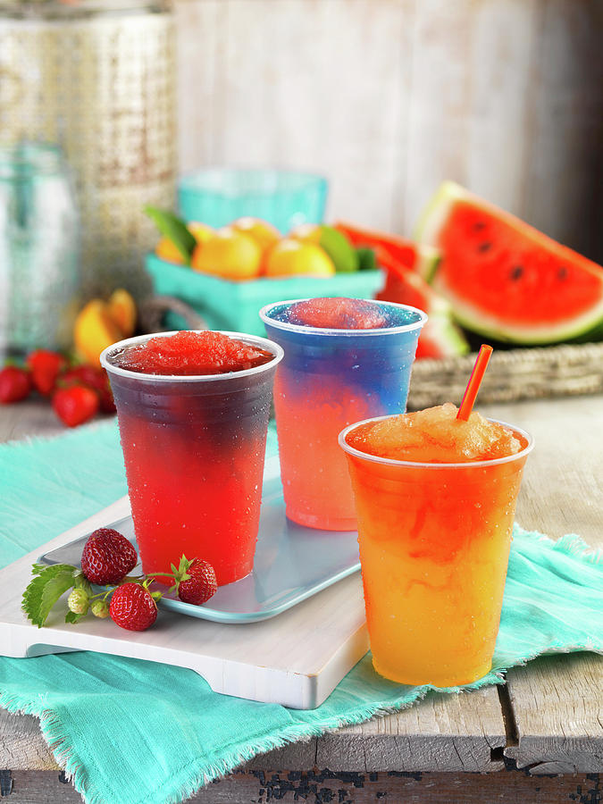 Three Different Fruity Slushies In Plastic Cups Photograph by Jim Scherer