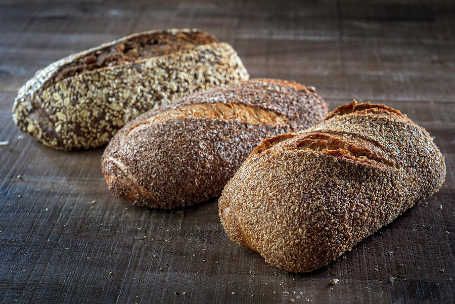 Three Different Loaves Of Seeded Bread Photograph by Lode Greven Photography