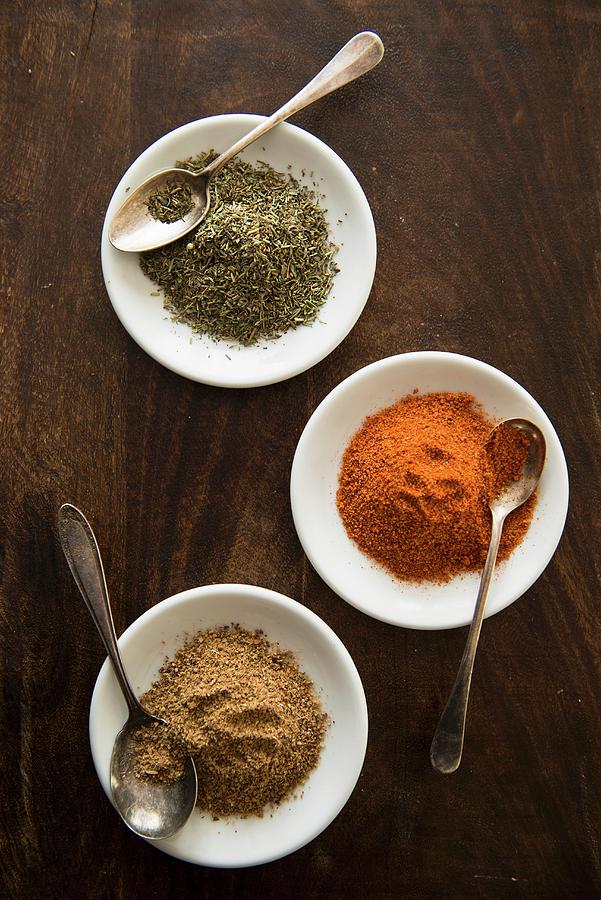 Three Different Spices In White Dishes Photograph by Studer, Veronika ...