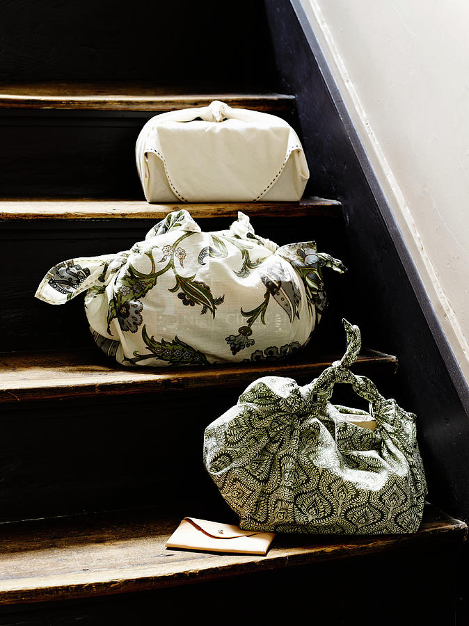Three Fabric Bags On Treads Of Old Staircase Photograph by Catherine Gratwicke