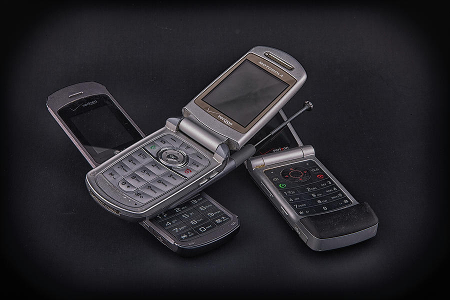 Three Flip Phones on Black Photograph by Darryl Brooks