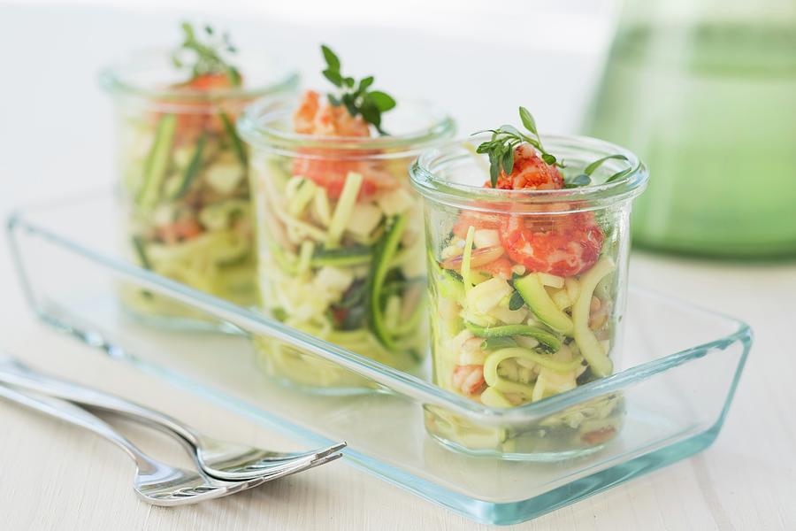 Three Glasses Of Courgette Salad With Crayfish, Mozzarella, Oregano And Pine Nuts Photograph by Jan Wischnewski