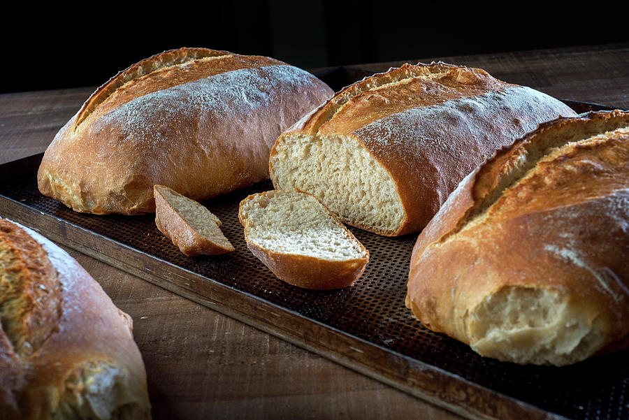 Three Loaves Of Freshly Baked White Bread, One Sliced Photograph by Lode Greven Photography