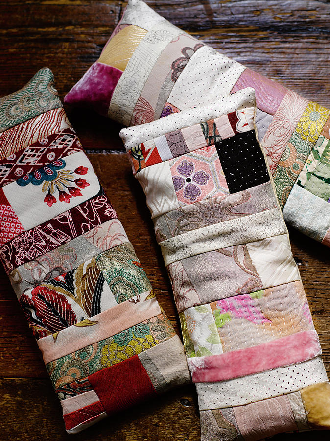 Three Long Patchwork Cushions Made From Feminine Fabrics Photograph by Catherine Gratwicke