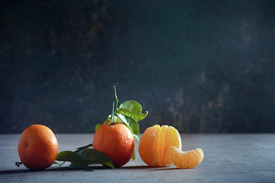 Three Mandarins, One Peeled Photograph by Christoph Maria Hnting