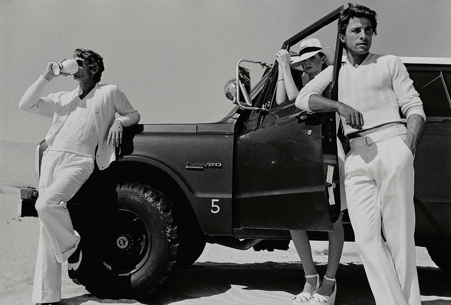 Three Models Around A Jeep In The Desert Photograph by Stephen Ladner
