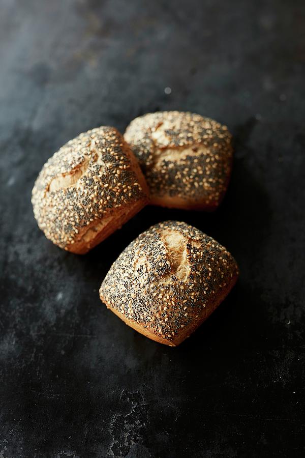 Three Multigrain Bread Rolls With Poppy Seeds Photograph by Rafael