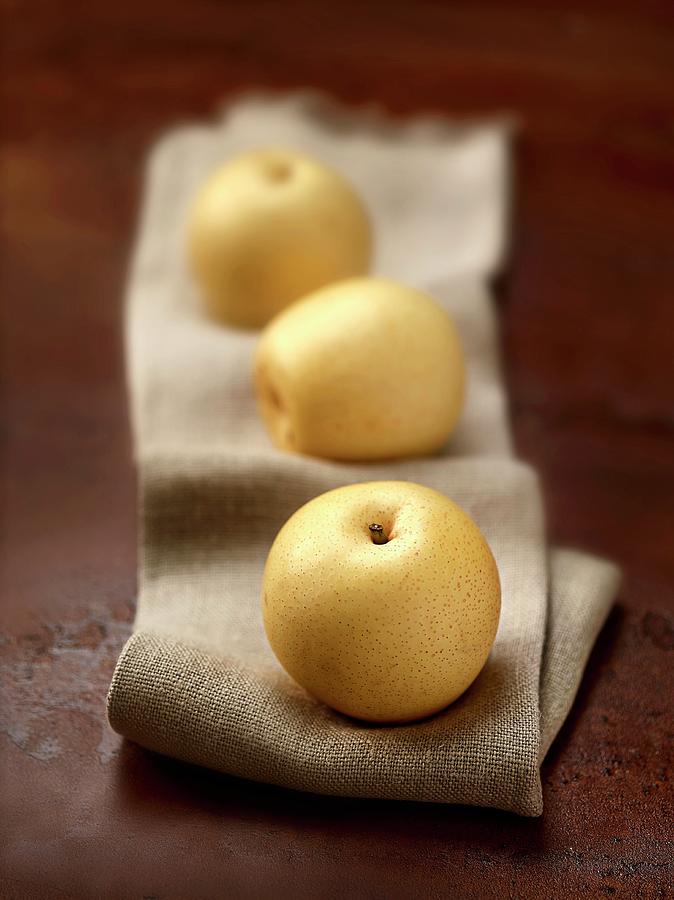 Three Nashi Pears On A Linen Cloth Photograph by Frdric Perrin