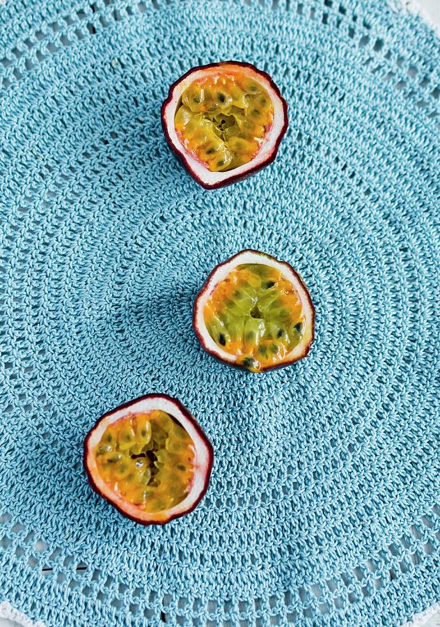 Three Passion Fruit Halves On A Crocheted Doily seen From Above Photograph by Dorota Indycka