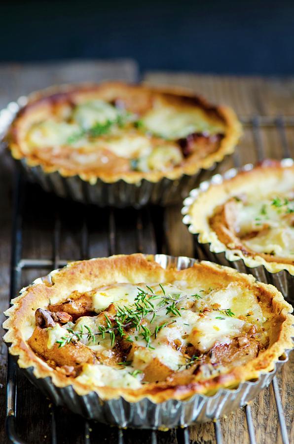 Three Pear And Gorgonzola Tartlets With Walnuts Photograph by Jamie Watson