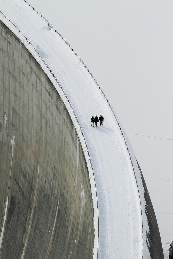 Three People Walking Above The Photograph by Fstop Images - Gerhard Fitzthum