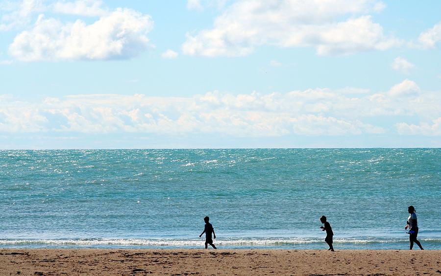 Summer Photograph - Three People Walking By Coast Line by J.castro