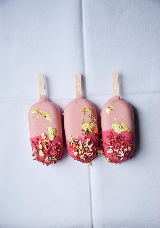 Three Pink Ice Cream Sticks With Gold Leaf Photograph by So Schmeckt Liebe