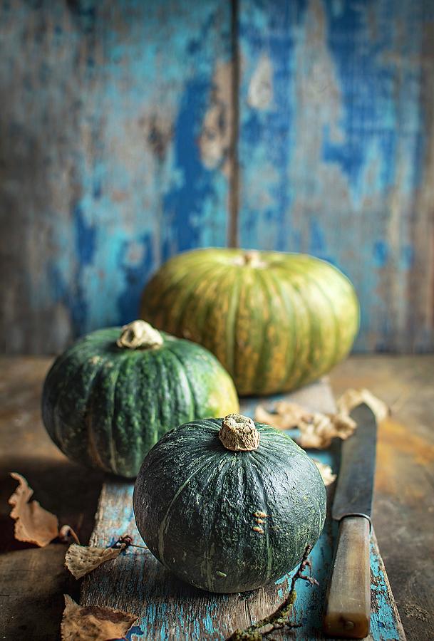 Three Pumpkins With Autumn Leaves Photograph by Olimpia Davies