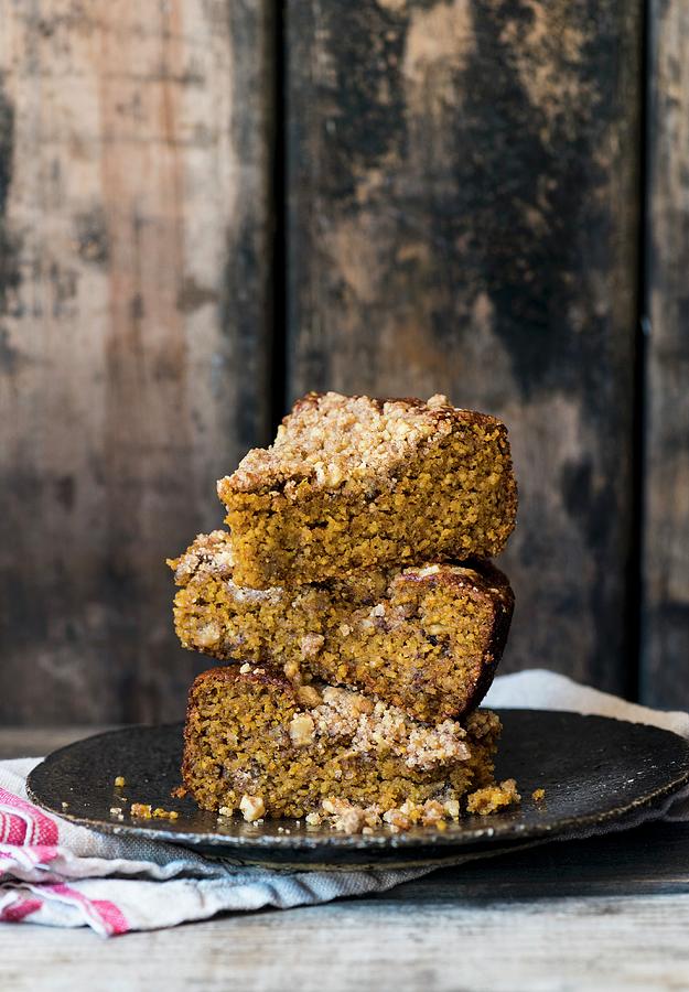 Three Sliced Of Freekeh Crumble Cake Stacked On A Plate Photograph by Hein Van Tonder