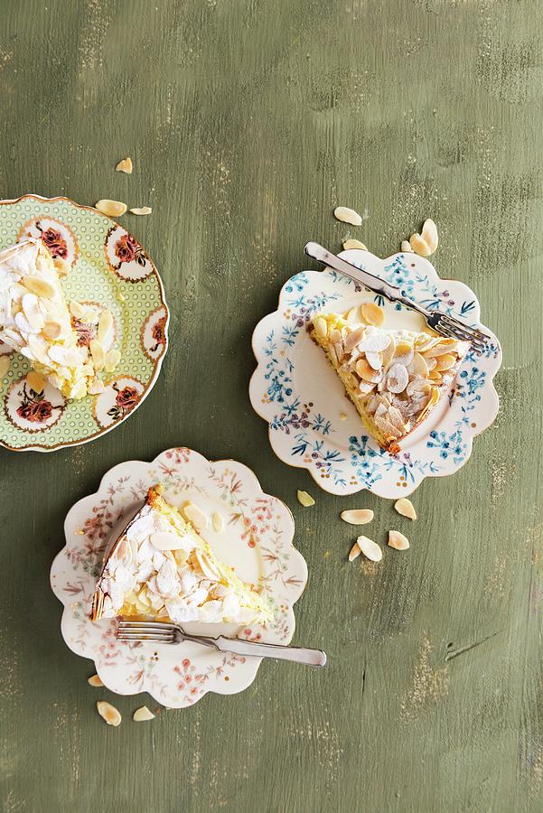 Three Slices Of Almond Cake With Icing Sugar Photograph by Veronika Studer