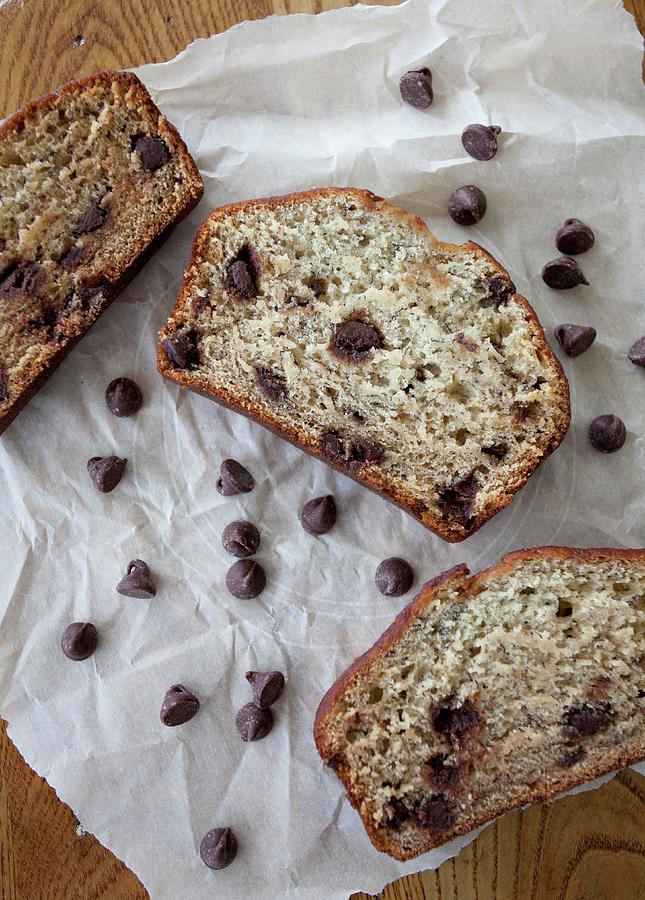 Three Slices Of Banana Bread With Chocolate Chips On A Piece Of Parchment Paper Photograph by Ryla Campbell