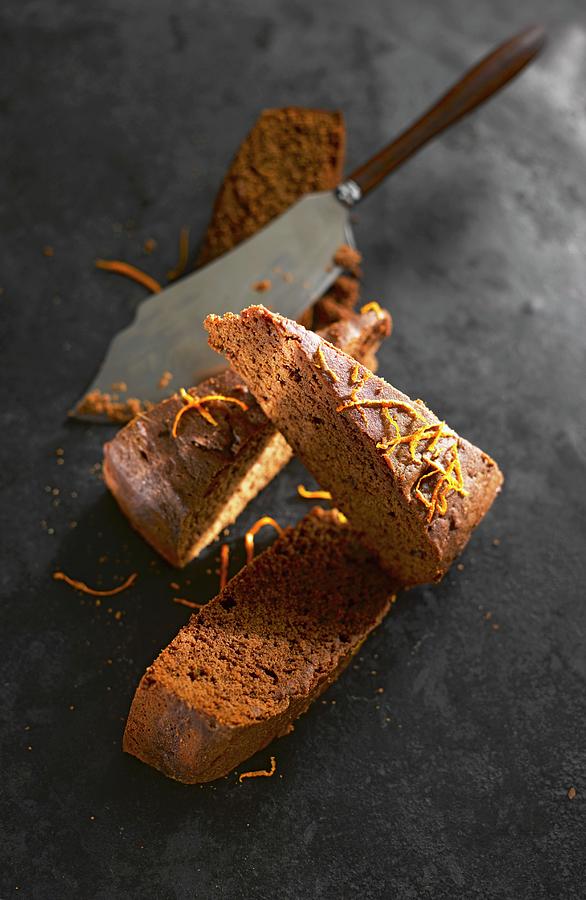 Three Slices Of Chocolate Orange Cake With Cake Slice Photograph by Kai Schwabe