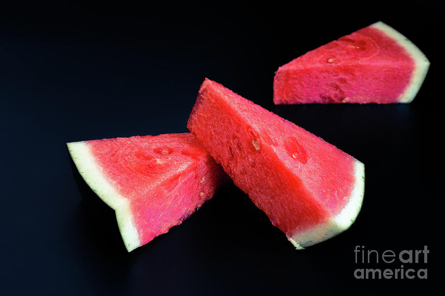 Three slices of watermelon stacked of intense color isolated on  Photograph by Joaquin Corbalan