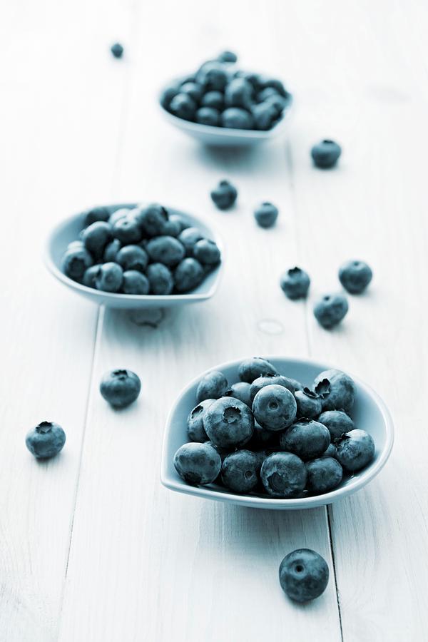 Three Small Bowls Of Blueberries Photograph by Petr Gross
