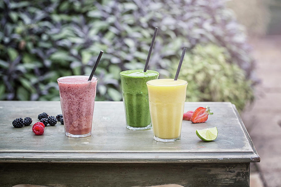 Three Smoothies On A Garden Table Photograph by Kirstie Young