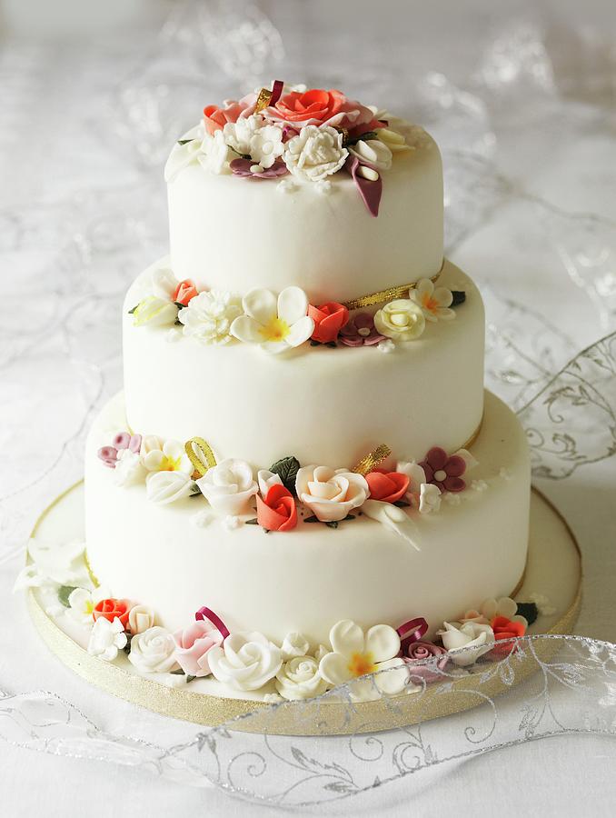 Three-tier Wedding Cake With Fondant Flowers Photograph by Rob Whitrow