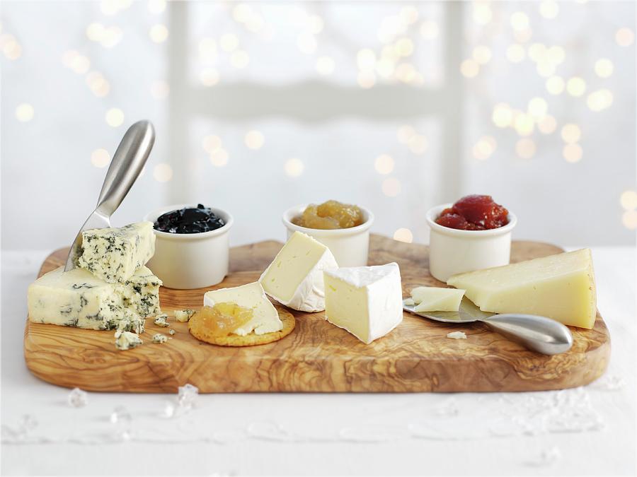 Three Types Of Cheeses With Accompanying Chutneys Photograph by Ian Garlick