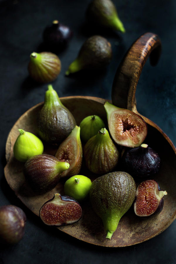 Three Types Of Organic Figs On An Old Wooden Board Photograph by Sabine Lscher