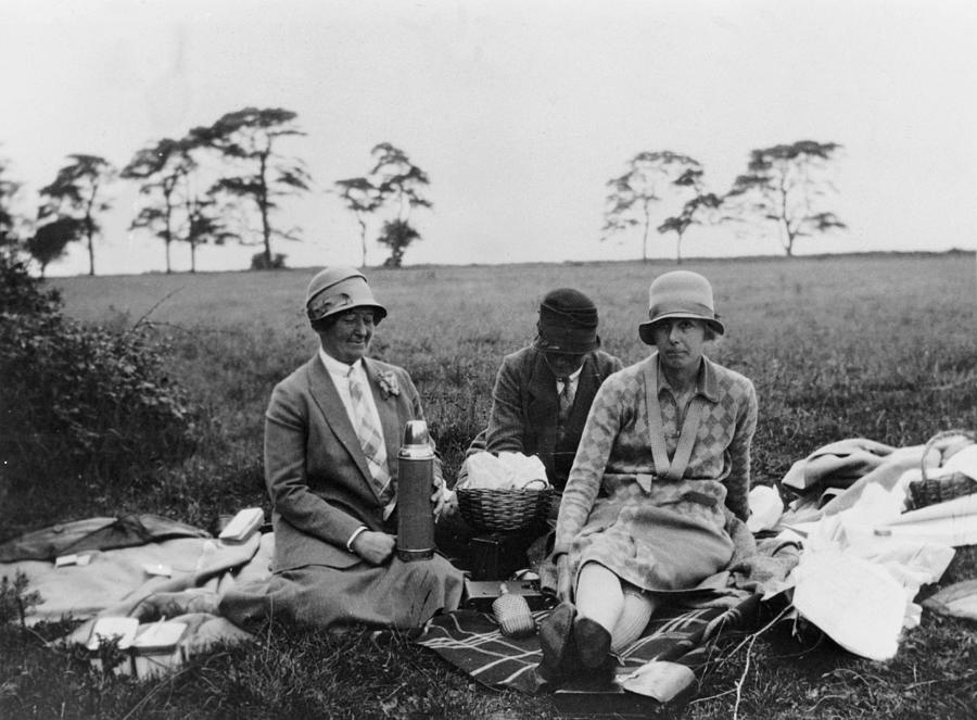 Three Women Having A Picnic In A Field Photograph by Heritage Images
