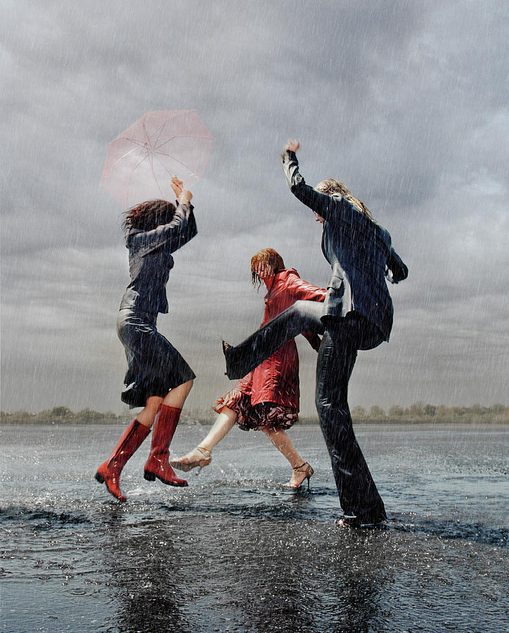 Three Women Having Fun In Rain Photograph by Matthias Clamer.