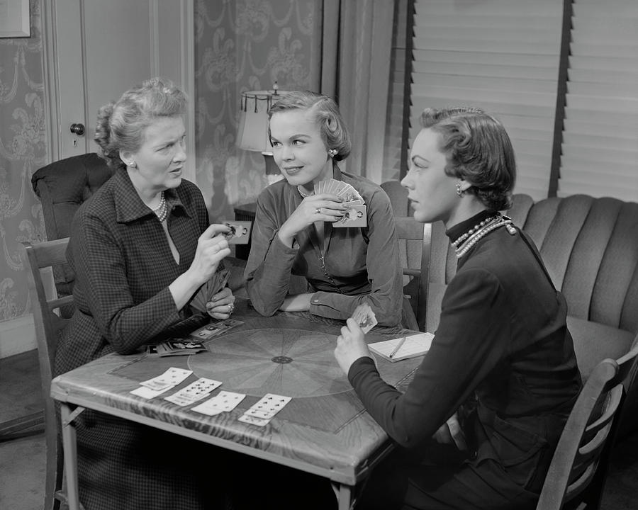 Three Women Playing Cards In Living Room Photograph by George Marks