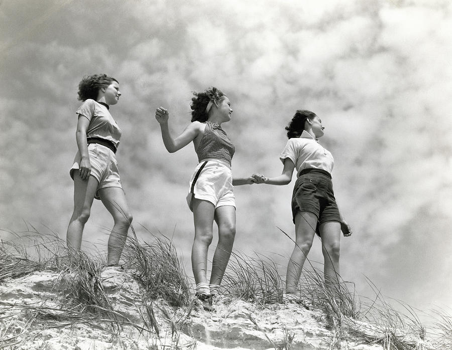 Three Women Standing On Beach, Holding Photograph by H. Armstrong Roberts