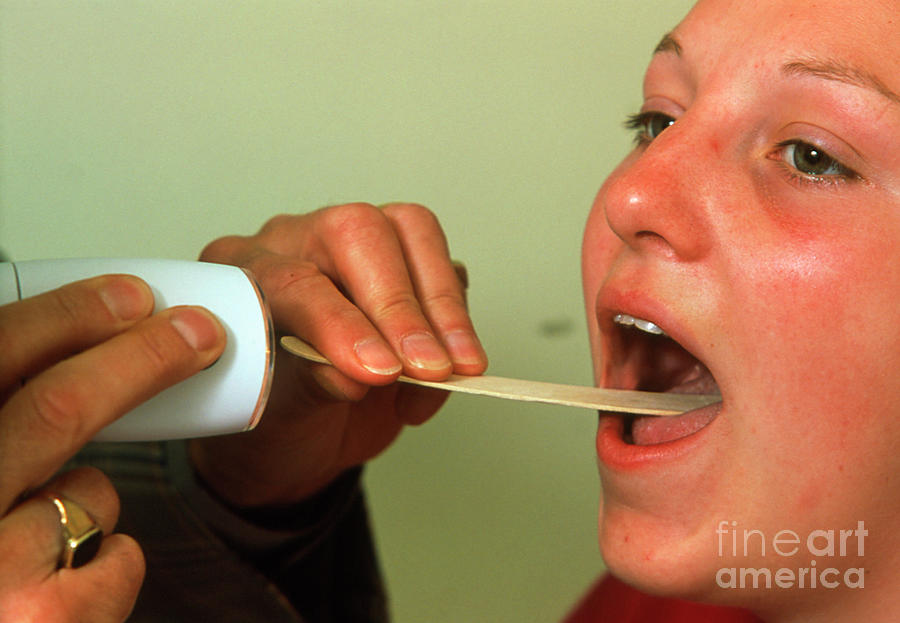 Boy With Mouth Open And Tongue Depressor #3 by Science Photo Library