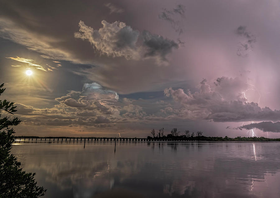 Thunderstorms and the Moon Photograph by Justin Battles