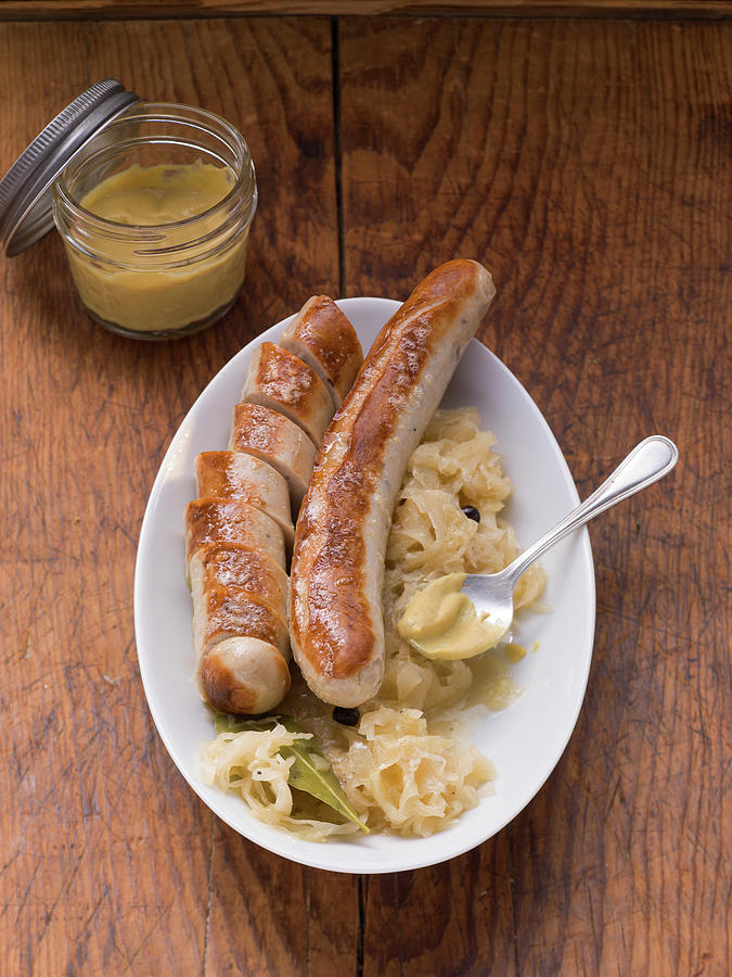 Thuringian Bratwurst With Sauerkraut And Mustard Photograph by Eising Studio