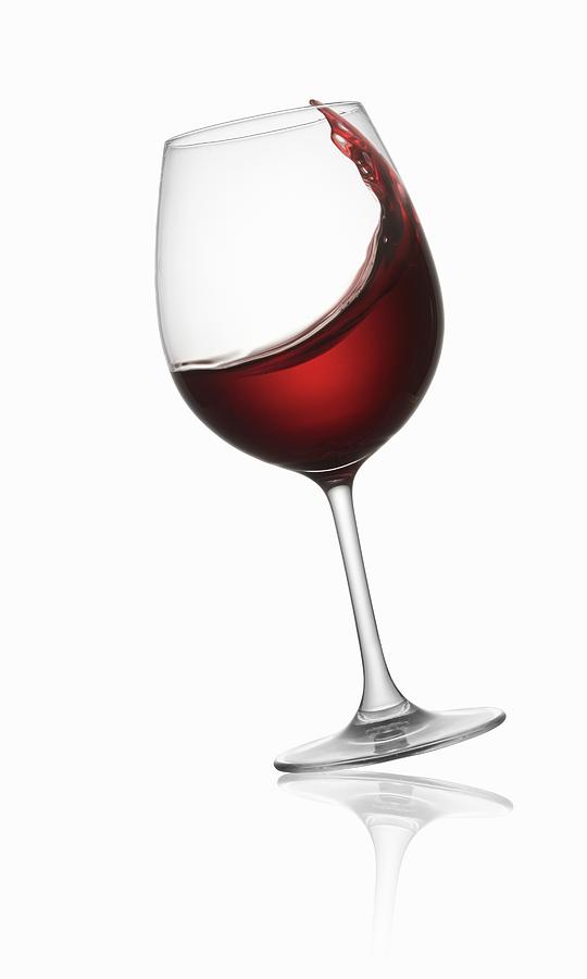 Tilted Red Wine Glass Photograph by Krger & Gross