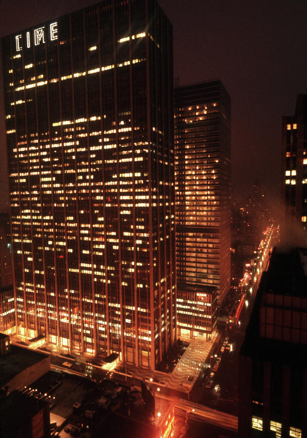 Architecture Photograph - Time and Life Building Exterior At Night by Walter Sanders