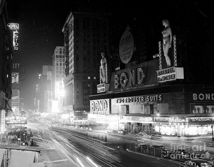 Times Square At Night Is A Bit Dimmer Photograph by New York Daily News Archive