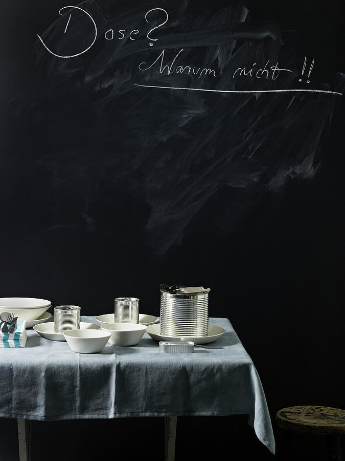 Tins And Crockery On A Table Photograph by Luzia Ellert