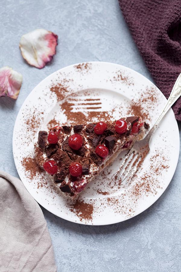 Tiramisu With Cherry And Chocolate On A White Plate Photograph by Sonya Baby