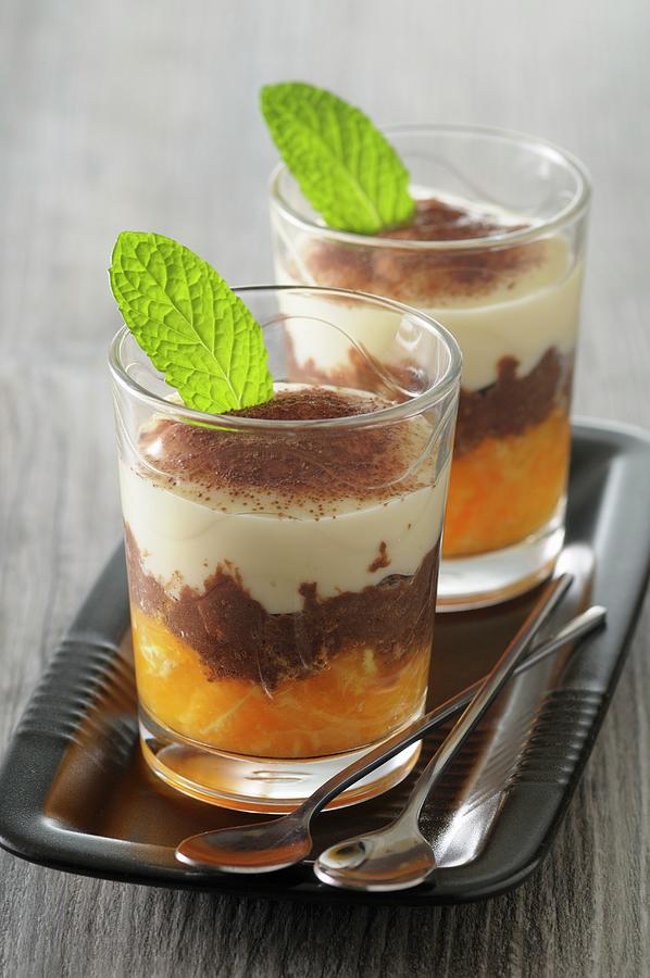 Tiramisu With Oranges And Cocoa In Dessert Glasses Photograph by Jean-christophe Riou
