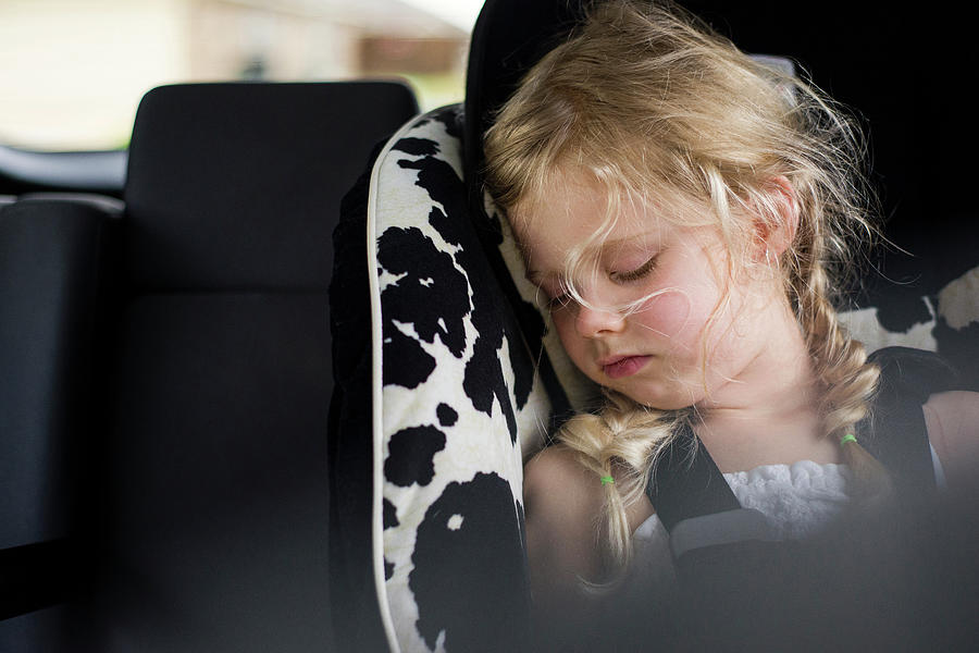 Tired Girl Sleeping In Car Photograph by Cavan Images - Fine Art America