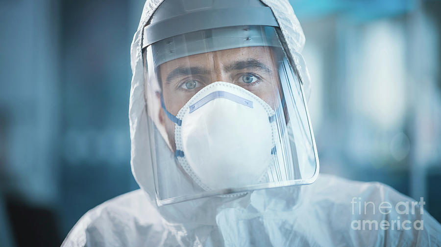 Tired Medical Worker Wearing A Face Mask Photograph by Gorodenkoff ...