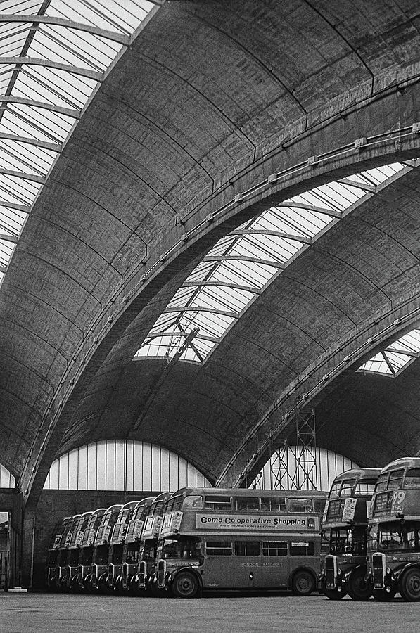 Architecture Photograph - Titans At Stockwell Bus Garage by Chris Morphet